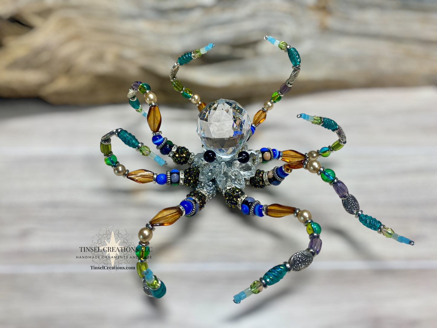 Decorative octopus made of beads on a neutral background