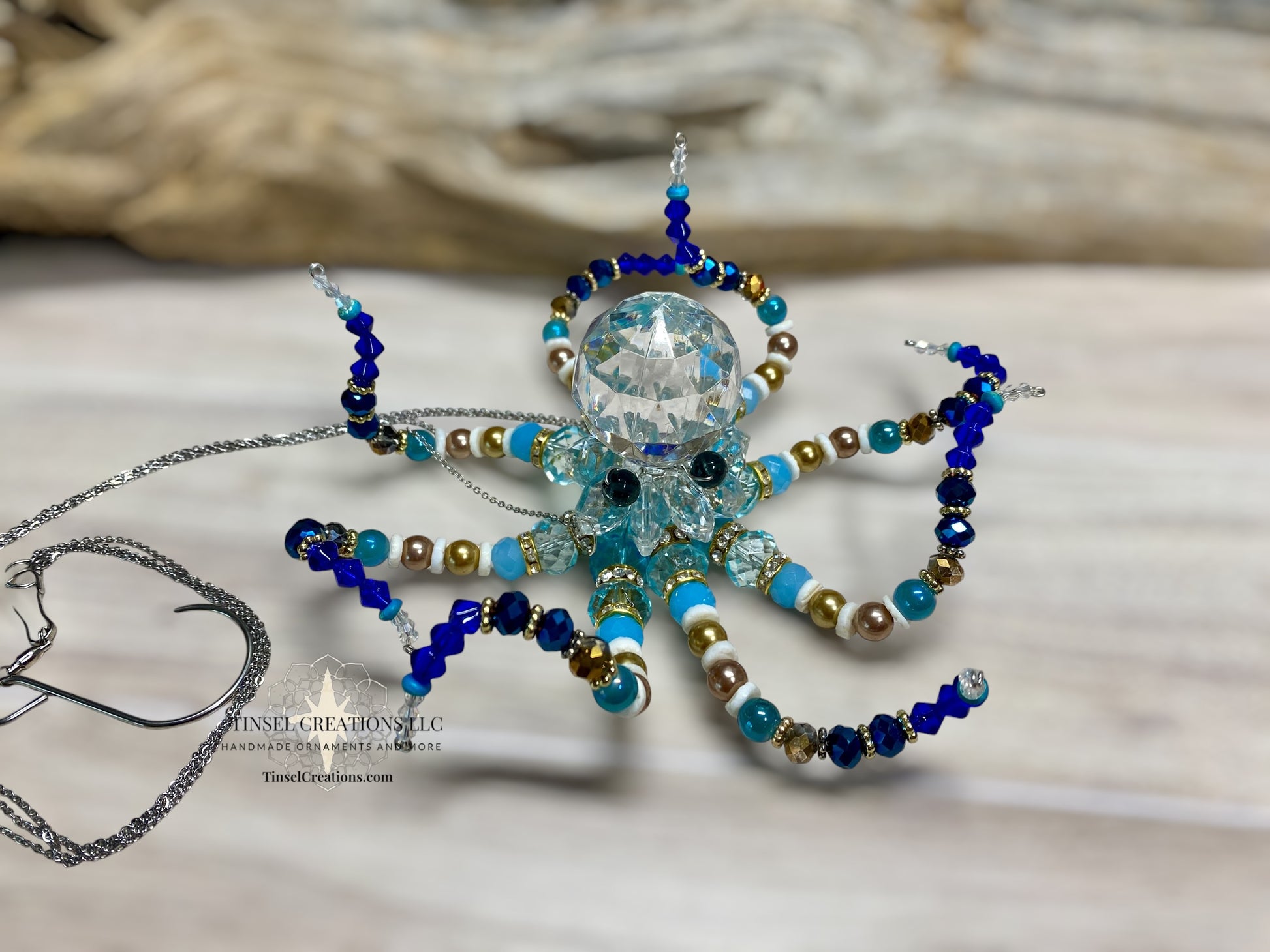 Decorative octopus suncatcher with beads on a neutral background